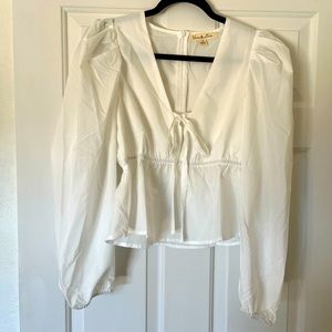 White V-neck neck blouse.